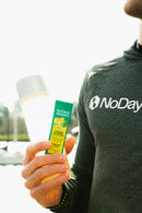 No Days Wasted Hydration Replenisher drink in a mason jar on a sunny beach day.