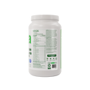 Scoop of Vega French Vanilla protein powder shown beside the container on a wooden counter