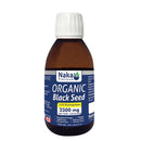 A bottle of Naka Organic Black Seed oil with a label showing the brand name and product details.