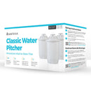 Santevia Mineralized Alkaline Water Pitcher Filter with sleek design, featuring a blue lid and a transparent water reservoir, positioned on a countertop in a bright kitchen setting.